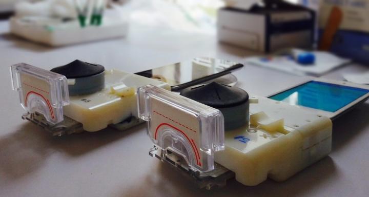 Smartphone dongles performed a point-of-care HIV and syphilis test in Rwanda from finger prick whole blood in 15 minutes, operated by health care workers trained on a software app.  Credit: Samiksha Nayak, Columbia Engineering. 